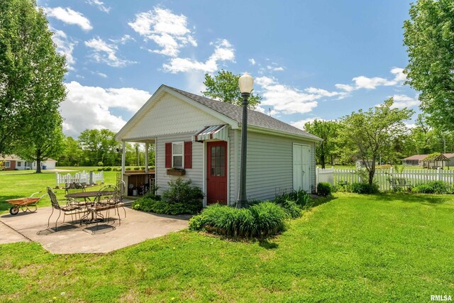 24 Karen Dr, Christopher, IL 62822 - rear view of property with a yard, fence, and a patio area