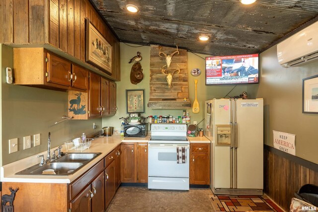 24 Karen Dr, Christopher, IL 62822 - kitchen featuring brown cabinets, a sink, white appliances, light countertops, and a wall mounted AC