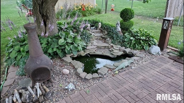 details with a small pond and fence