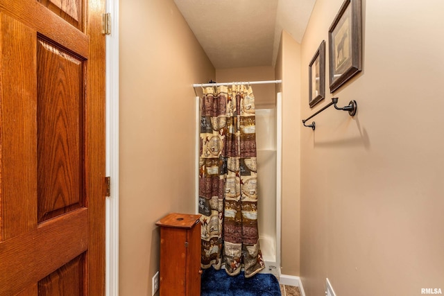 bathroom with a shower with shower curtain