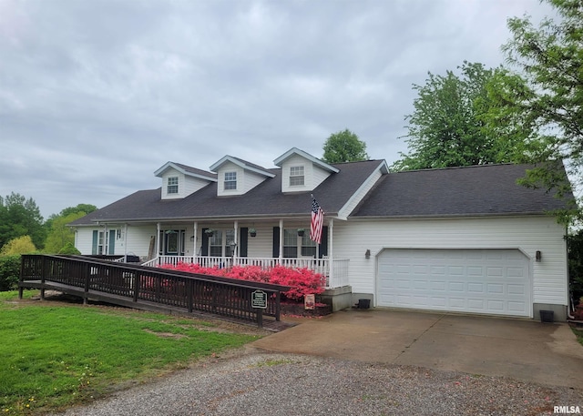 325 W N St, Dix, IL 62830 - view of front of house with a porch, concrete driveway, a garage, and a front yard