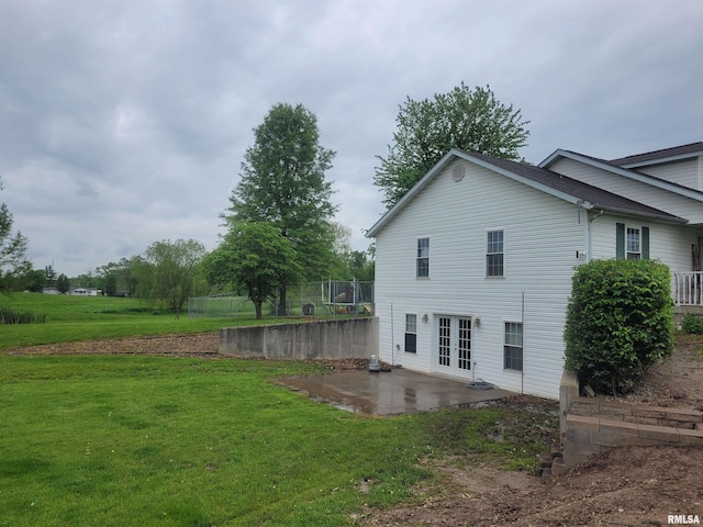 325 W N St, Dix, IL 62830 - view of side of home featuring a yard, a patio area, and french doors