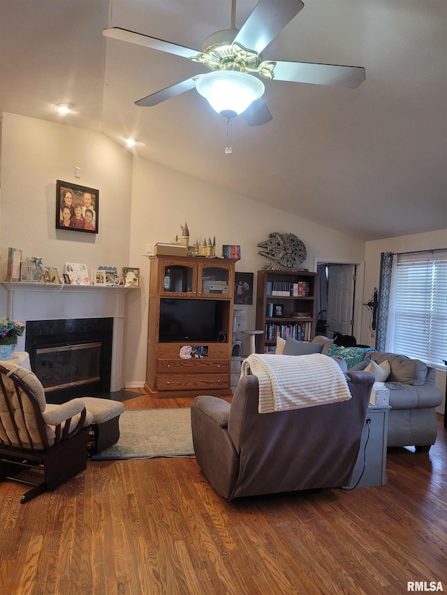 325 W N St, Dix, IL 62830 - living area with vaulted ceiling, wood finished floors, a ceiling fan, and a glass covered fireplace