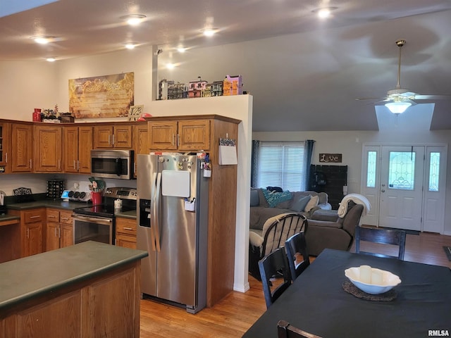 325 W N St, Dix, IL 62830 - kitchen with a ceiling fan, light wood-style flooring, brown cabinets, dark countertops, and stainless steel appliances