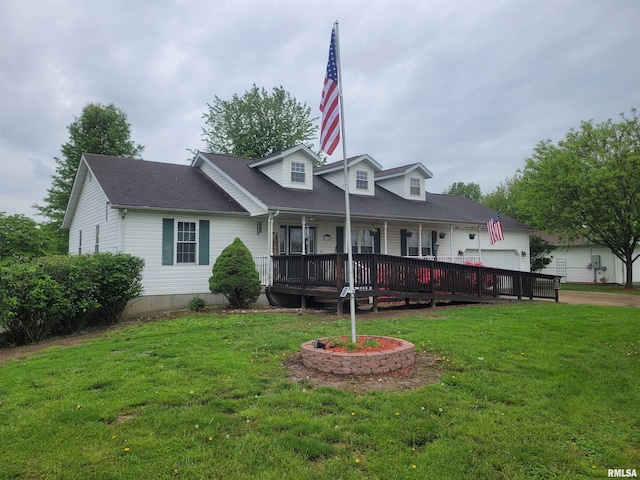 325 W N St, Dix, IL 62830 - view of front of home with covered porch, a garage, driveway, a front yard, and roof with shingles