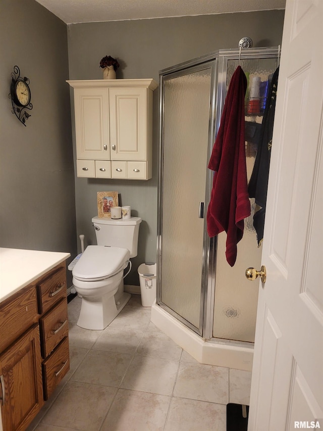 325 W N St, Dix, IL 62830 - full bathroom with a stall shower, vanity, toilet, and tile patterned floors