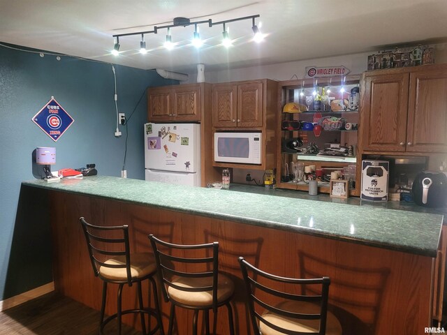 325 W N St, Dix, IL 62830 - bar with white appliances and wood finished floors