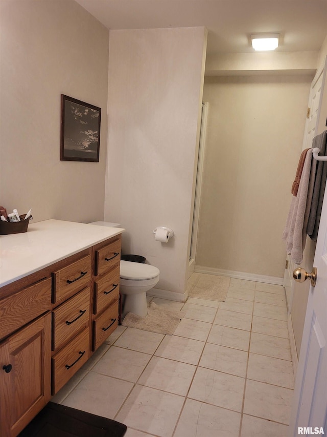 325 W N St, Dix, IL 62830 - full bathroom with toilet, tile patterned floors, baseboards, a shower stall, and vanity