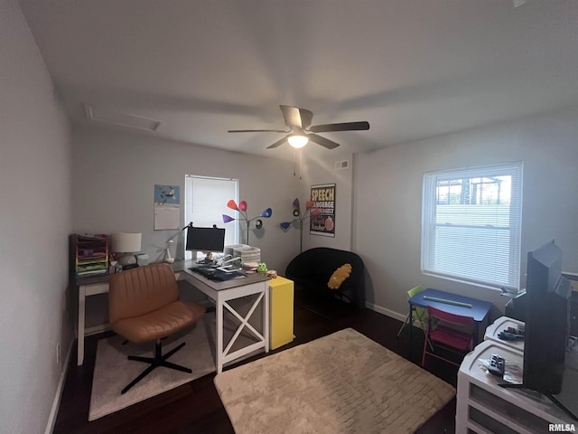 home office featuring attic access, a wealth of natural light, dark wood-type flooring, and baseboards