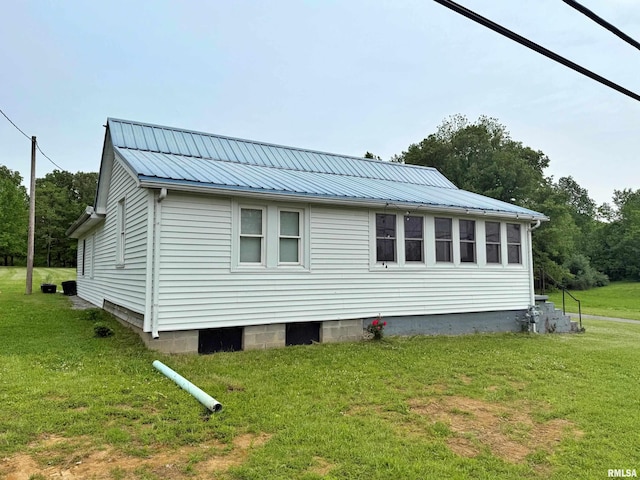 85 W State Highway 146, Golconda, IL 62938 - view of side of property featuring a yard and metal roof