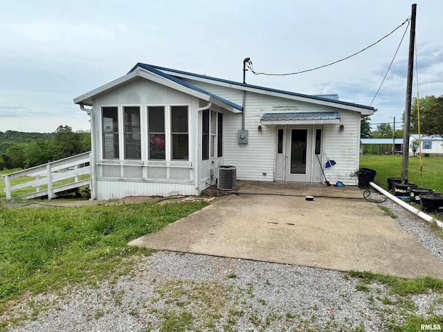 85 W State Highway 146, Golconda, IL 62938 - back of property with central air condition unit and a sunroom