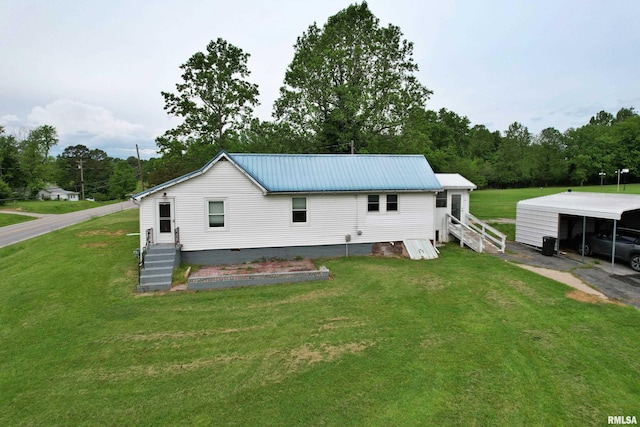 85 W State Highway 146, Golconda, IL 62938 - back of house featuring a yard, metal roof, a carport, and crawl space