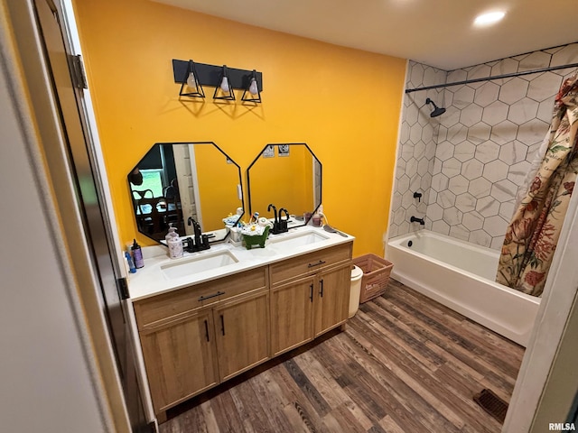 85 W State Highway 146, Golconda, IL 62938 - full bath featuring double vanity, shower / tub combo with curtain, wood finished floors, and a sink