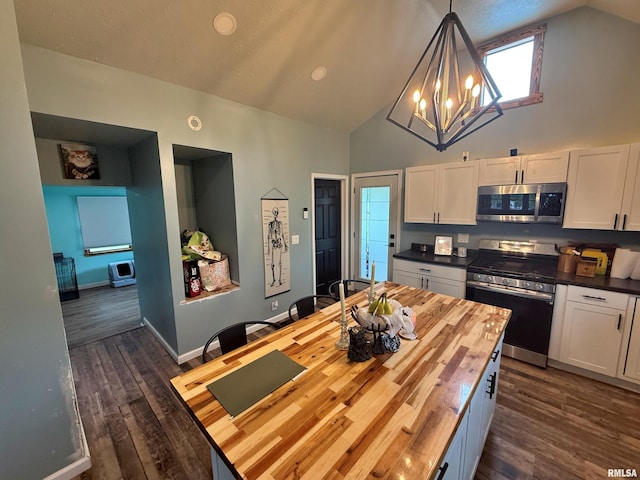85 W State Highway 146, Golconda, IL 62938 - kitchen with stainless steel appliances, wooden counters, dark wood-type flooring, and white cabinets