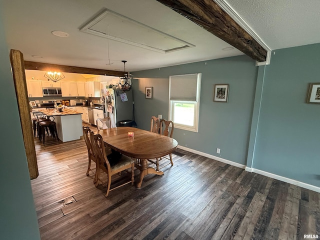 85 W State Highway 146, Golconda, IL 62938 - dining room featuring attic access, dark wood-style flooring, and baseboards
