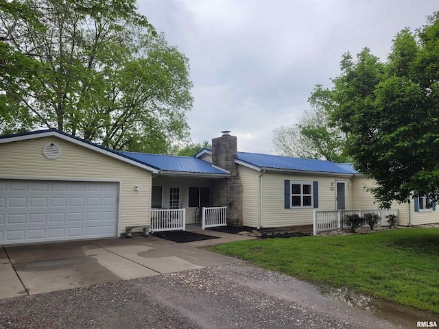 single story home with an attached garage, a chimney, concrete driveway, a front yard, and a porch