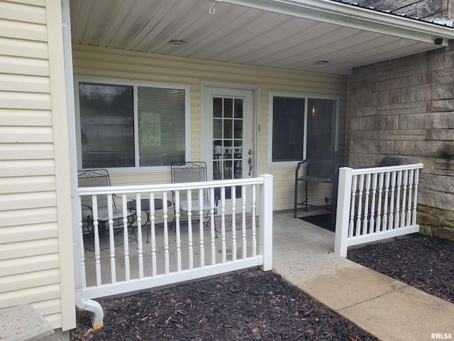 property entrance featuring covered porch