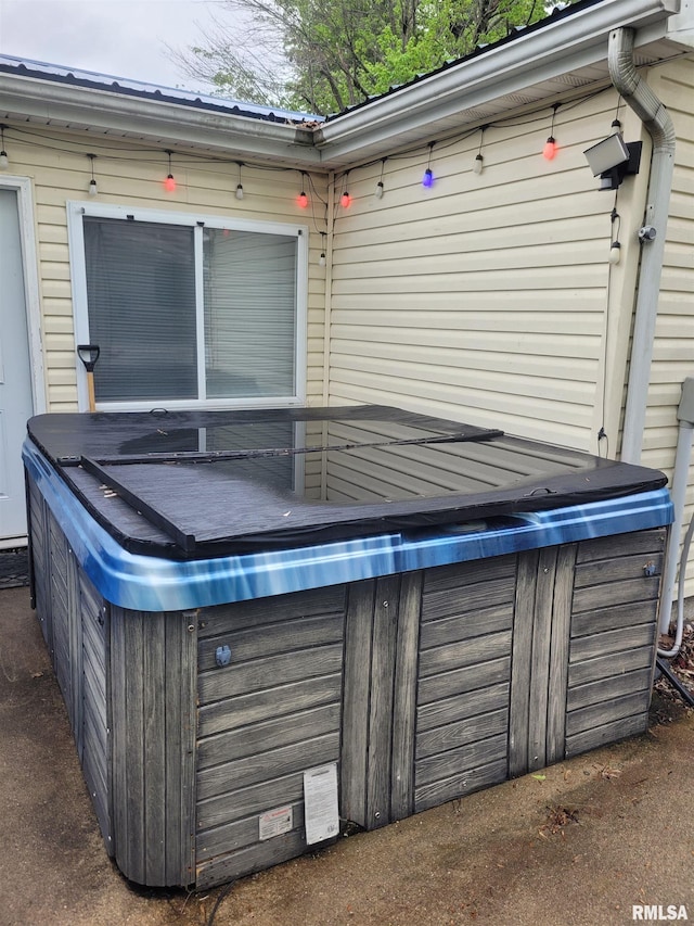 exterior space featuring a hot tub