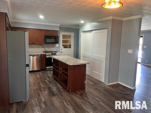 kitchen featuring stainless steel appliances, open shelves, dark wood-type flooring, crown molding, and light countertops