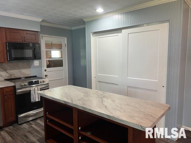 kitchen with stainless steel electric range oven, dark wood finished floors, black microwave, crown molding, and light countertops