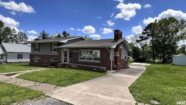 1908 E Oak St, West Frankfort, IL 62896 - split level home with a chimney, brick siding, and a front lawn