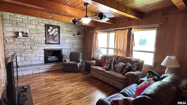 1908 E Oak St, West Frankfort, IL 62896 - living room featuring ceiling fan, wood ceiling, beamed ceiling, hardwood / wood-style floors, and a fireplace