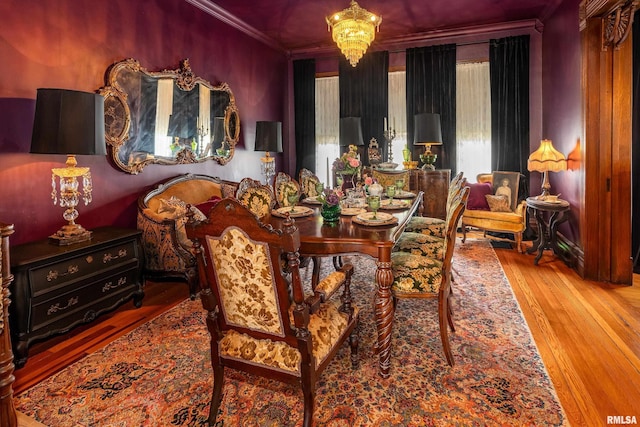 301 W High St, Anna, IL 62906 - dining space featuring ornamental molding, wood finished floors, and a chandelier