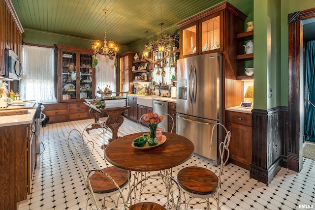 301 W High St, Anna, IL 62906 - kitchen featuring appliances with stainless steel finishes, open shelves, a chandelier, light flooring, and light countertops