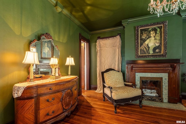 301 W High St, Anna, IL 62906 - living area with crown molding, wood-type flooring, and a brick fireplace