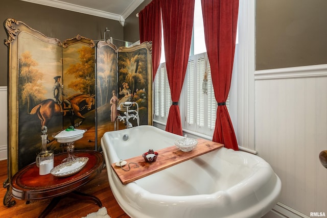 301 W High St, Anna, IL 62906 - full bathroom with a freestanding bath, crown molding, a baseboard heating unit, wood finished floors, and a wainscoted wall