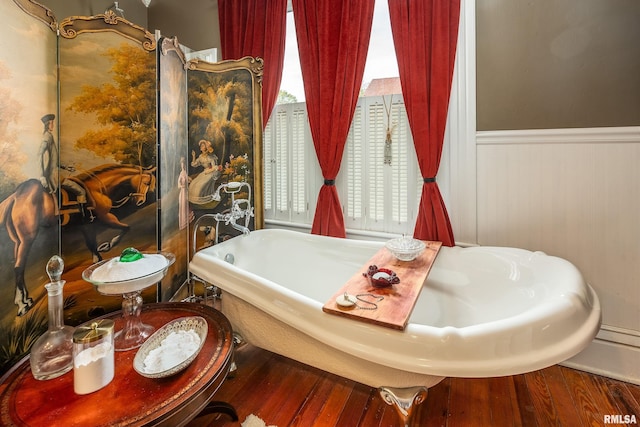 301 W High St, Anna, IL 62906 - full bathroom featuring wood finished floors, a soaking tub, and wainscoting