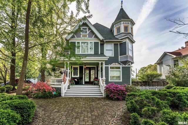 301 W High St, Anna, IL 62906 - victorian-style house featuring a porch and fence