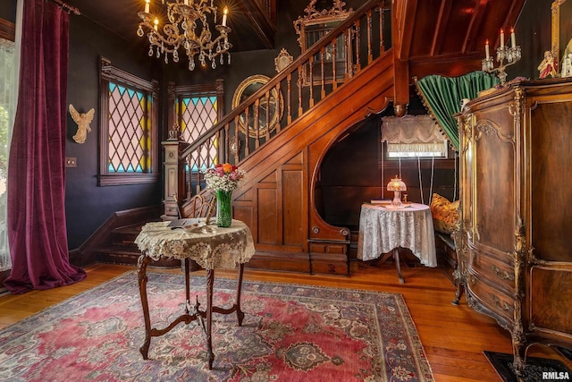 301 W High St, Anna, IL 62906 - living area featuring a chandelier, stairway, and wood finished floors