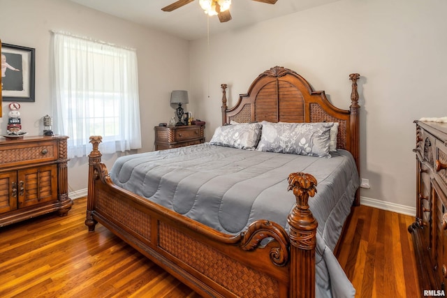 bedroom featuring wood finished floors, ceiling fan, and baseboards