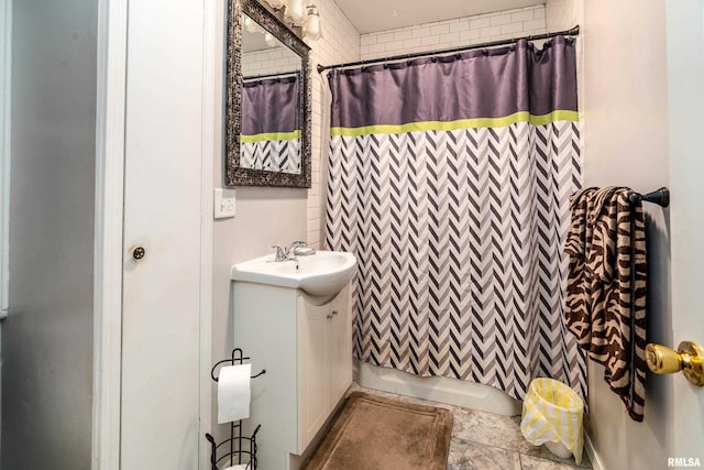 bathroom with vanity and shower / tub combo with curtain