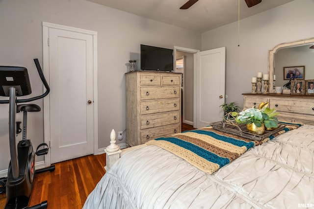 bedroom featuring wood finished floors, baseboards, and a ceiling fan