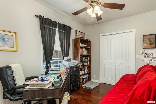 office area with dark wood-style floors, ceiling fan, and baseboards