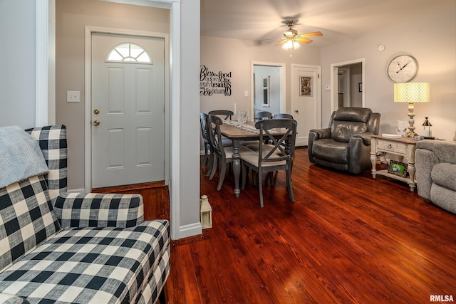 living room featuring wood finished floors and ceiling fan