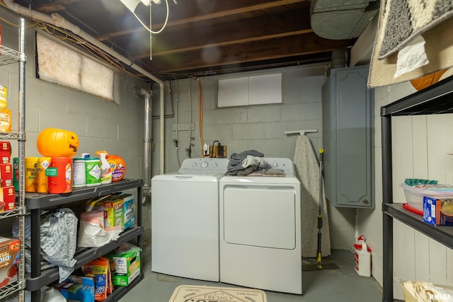 clothes washing area featuring washer and clothes dryer