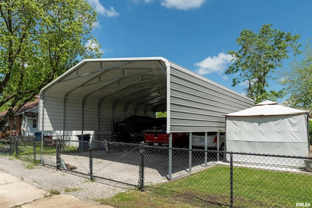 view of parking featuring a carport and fence