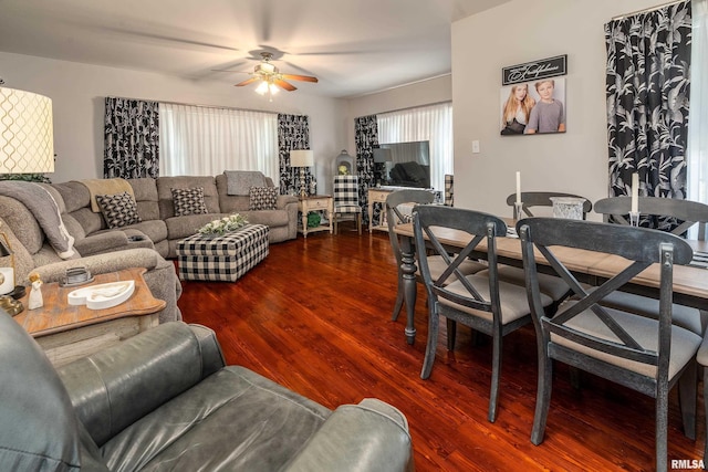 living room with wood finished floors and a ceiling fan