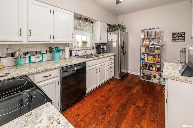 kitchen with black appliances, dark wood-style flooring, a sink, and tasteful backsplash