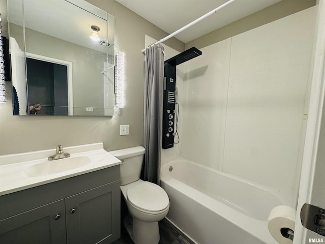 bathroom featuring toilet, vanity, and shower / tub combo
