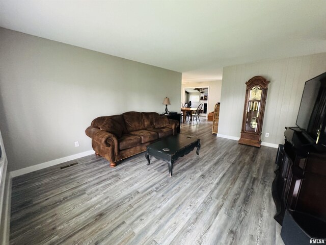 living room with wood finished floors and baseboards