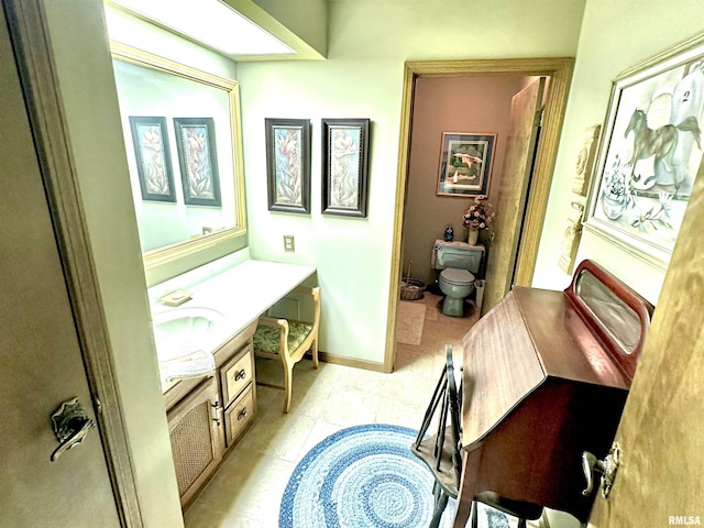 7 Lakewood Dr, Centralia, IL 62801 - bathroom featuring toilet, vanity, and tile patterned floors