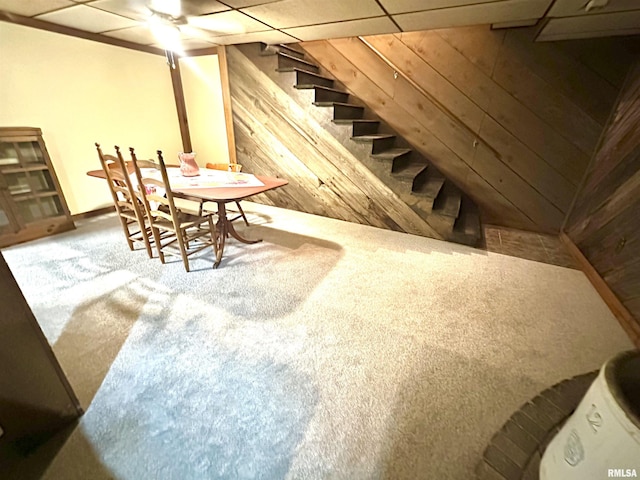 7 Lakewood Dr, Centralia, IL 62801 - carpeted dining space with stairway, wooden walls, and a drop ceiling