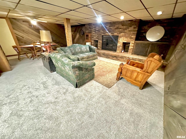 7 Lakewood Dr, Centralia, IL 62801 - carpeted living room with a fireplace, a drop ceiling, and wooden walls