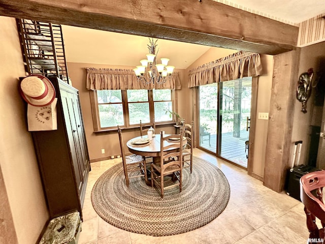 7 Lakewood Dr, Centralia, IL 62801 - dining space featuring vaulted ceiling, a chandelier, light tile patterned floors, and baseboards
