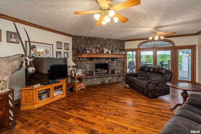500 Swink Ln, Jonesboro, IL 62952 - living room with hardwood / wood-style floors, ceiling fan, ornamental molding, a textured ceiling, and a fireplace