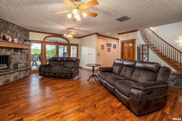 500 Swink Ln, Jonesboro, IL 62952 - living area featuring a textured ceiling, hardwood / wood-style floors, crown molding, stairway, and ceiling fan